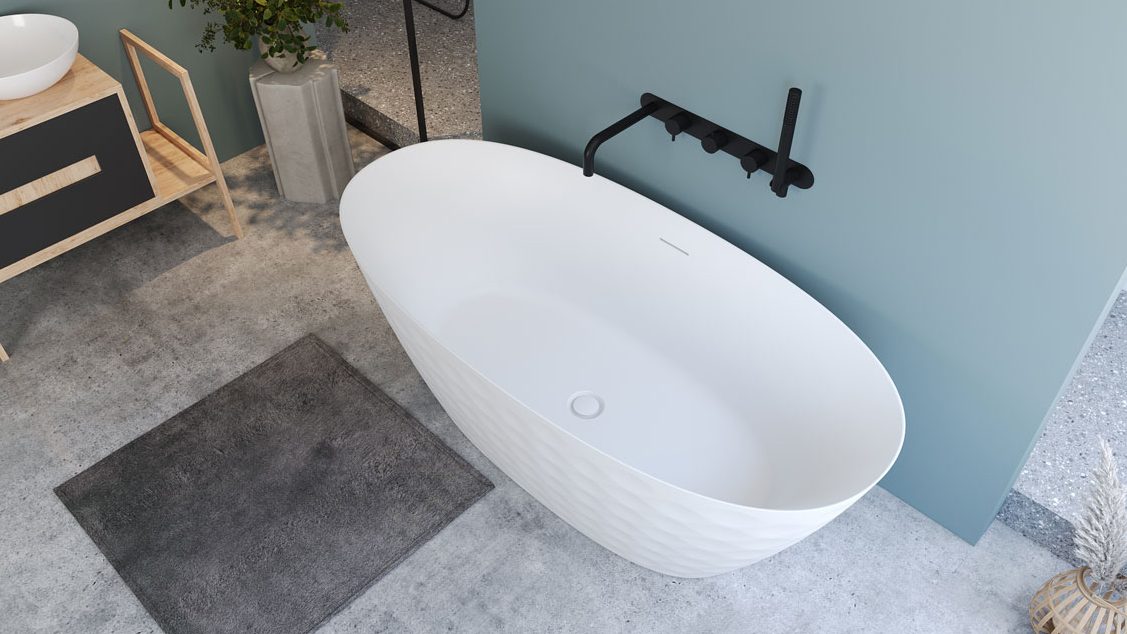 a white bathtub with a black faucet